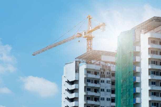 istock Crane and building construction and blue sky. 1225929541