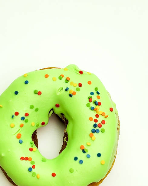 istock Donut with green glaze on white background top view 1225930451