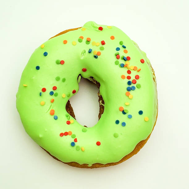 istock Delicious glazed donut green on a white background 1225930464