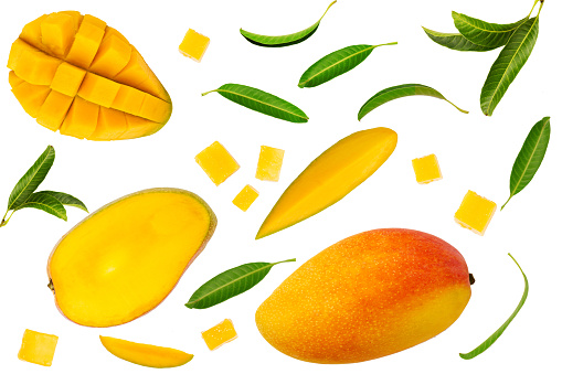 Tropical mango fruit with green leaf, piece of slice and cube shape flat lay on isolated white background.