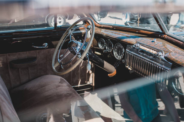 istock View through the open window on the interior of a retro car 1225931598