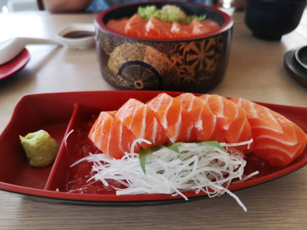 istock Close up slice of salmon sashimi 1225931642