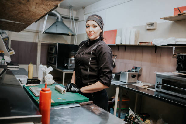 istock beautiful woman chef prepares sushi on restaurant kitchen 1225932819