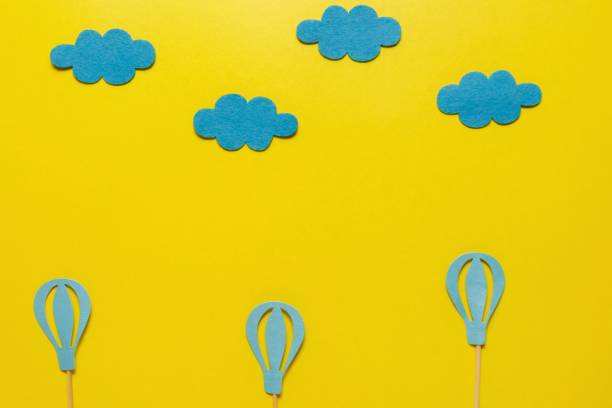 istock flatout Birthday party card on a yellow background with copy space for text 1225933558