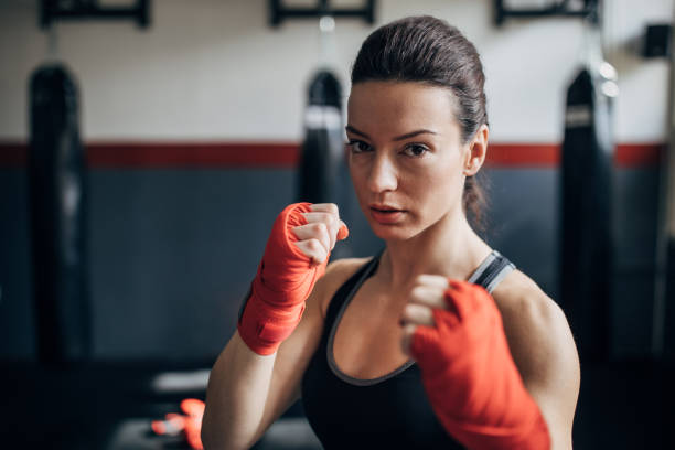 istock Female boxer standing in fighting stance 1225935739