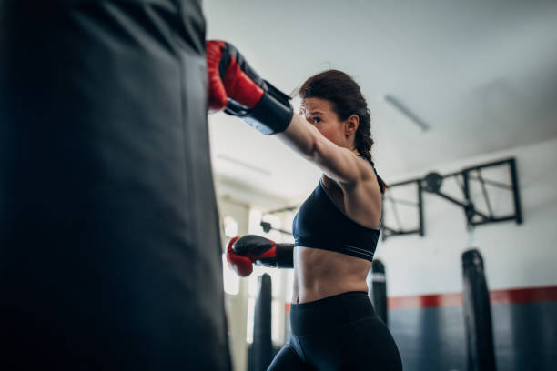 istock Female boxer training alone in gym 1225935779