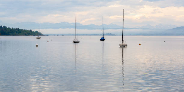istock Panorama with four sailboats at Ammersee (Bavaria, Germany). 1225939089