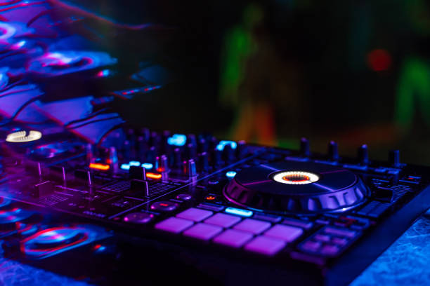 istock music mixer DJ controller in booth at nightclub 1225939323
