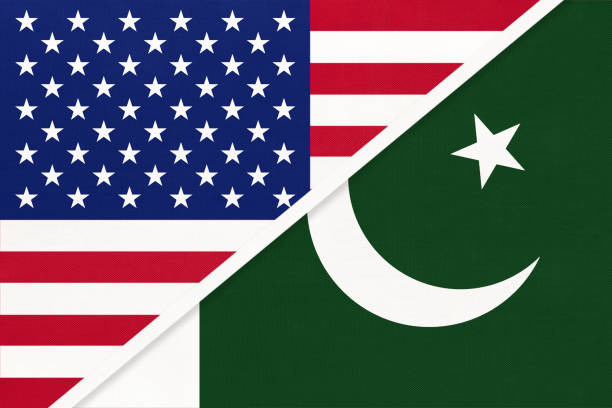 istock USA vs Pakistan national flag from textile. Relationship between two american and asian countries. 1225940478