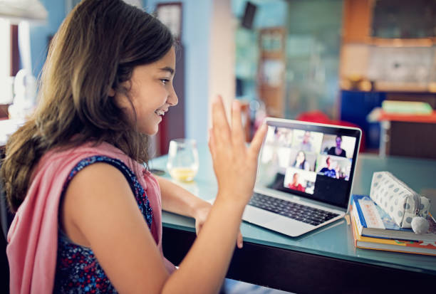 istock Schoolgirl is e-learning and video conferencing at home 1225941288