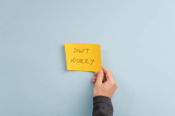istock Don't worry sign on yellow post it paper 1225941511