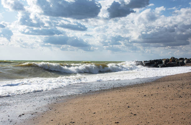 istock Big waves roll up on the beach 1225944435