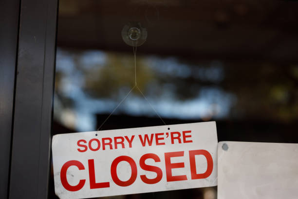 istock store shop close sign hanging 1225945929