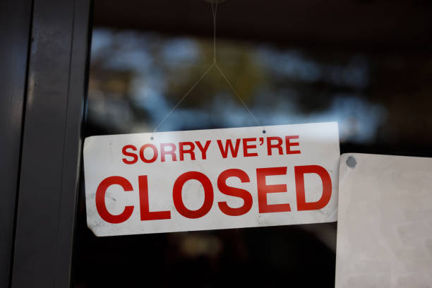 istock store shop close sign hanging 1225946590