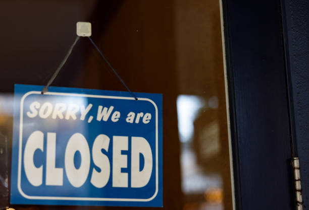 istock store shop close sign hanging 1225947191