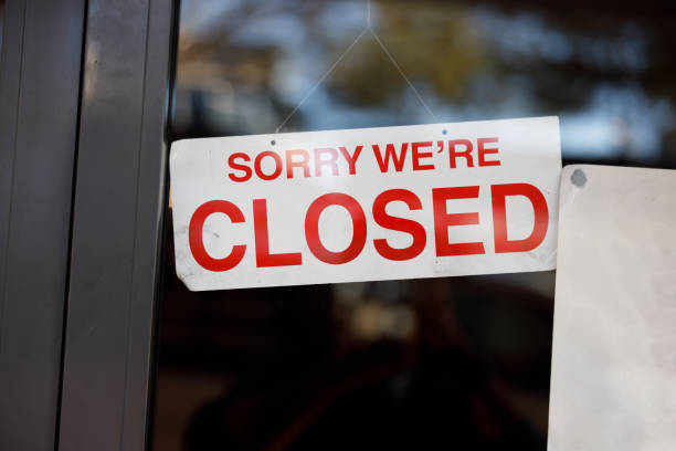 istock store shop close sign hanging 1225947287
