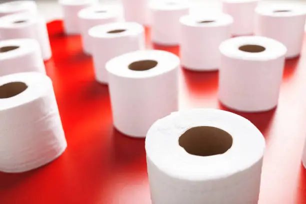 Toilet paper roll on a red background