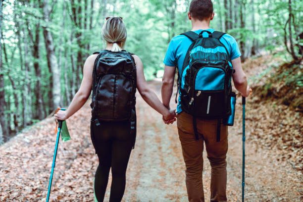 Couple Walking Hand In Hand During Forest Hiking