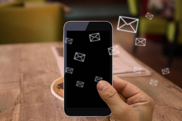 Man holding mobile smart phone with message on screen on white background