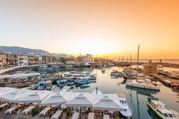 Landscape of the Girne Harbor and marina at sunset. Kyrenia or Girne is a city on the northern coast of Cyprus, noted for its historic harbour and castle.