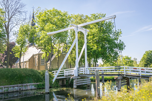 Traditional dutch drawbridge in the village of Zevenhuizen, close to Gouda, Netherlands.