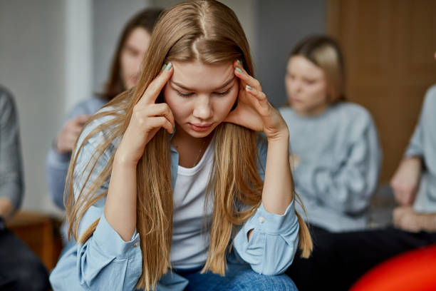 istock depressed young woman sit looking down 1225960107