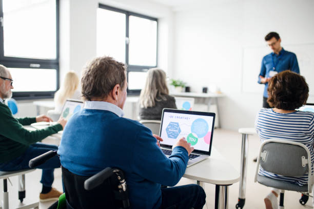 istock Group of senior people attending computer and technology education class. 1225961091