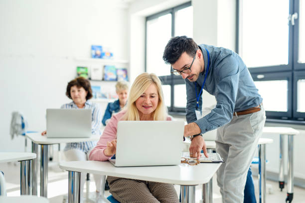 istock Group of senior people attending computer and technology education class. 1225961226