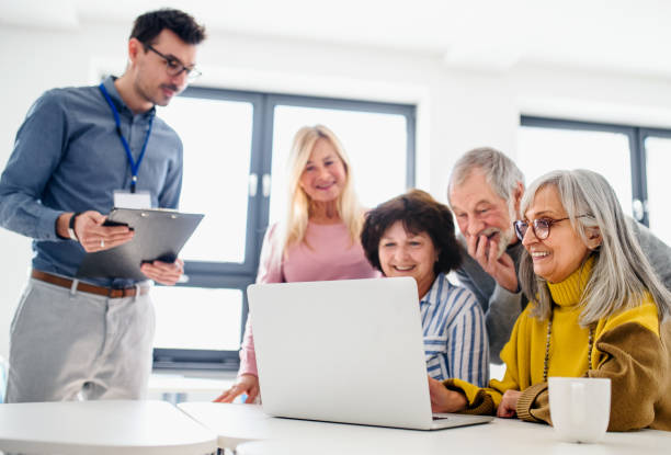 istock Group of senior people attending computer and technology education class. 1225961241