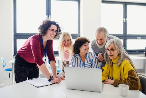 istock Group of senior people attending computer and technology education class. 1225961280