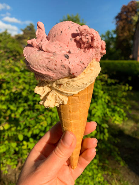 istock Ice cream balls in a waffle cone in female hand 1225961512