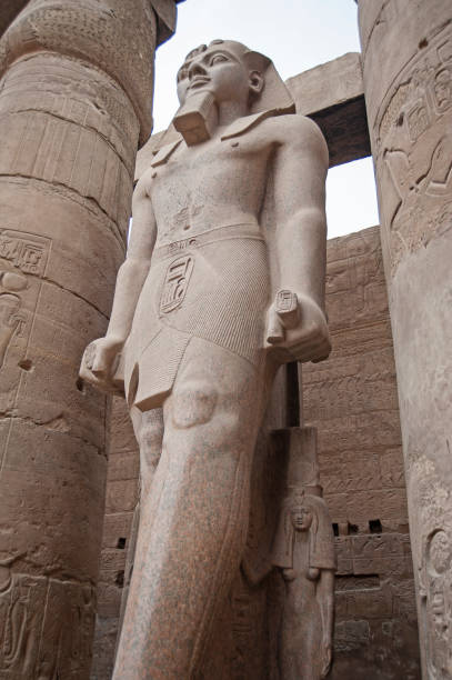 istock Statue and hieroglyphic carvings at an ancient egyptian temple 1225961879