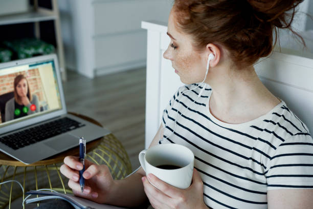 istock Home video conference with another woman 1225962024