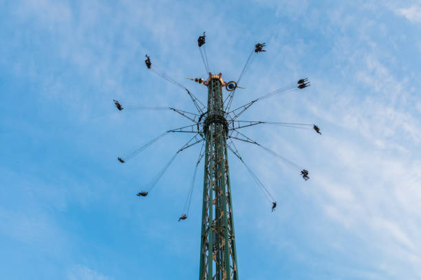 istock Amusement Park Carousel at the top with a blue sky in background 1225963519