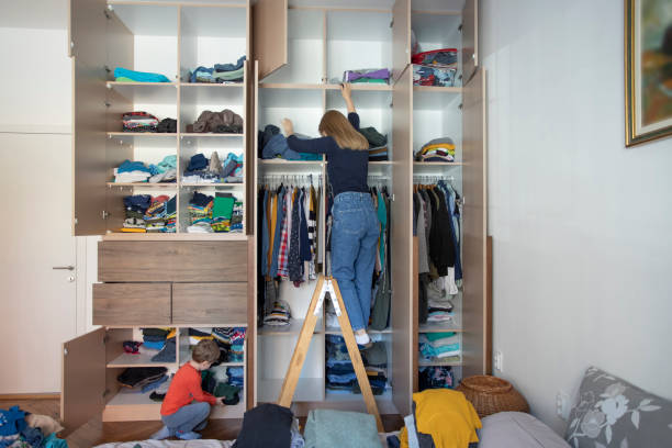 istock Woman reorganizing her wardrobe during quarantine time 1225965089