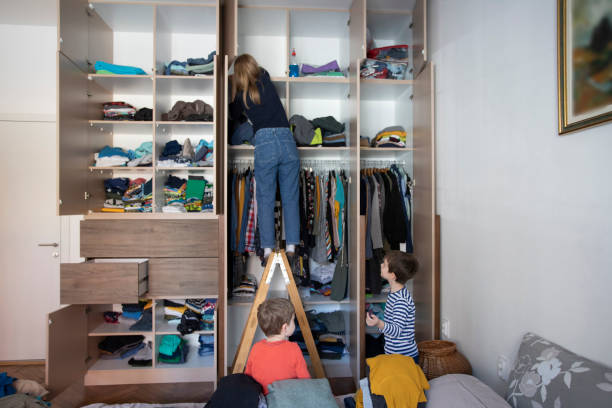 istock Woman reorganizing her wardrobe 1225965258
