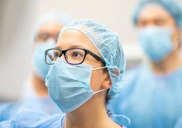 istock Group of surgeons examining a screen 1225965334