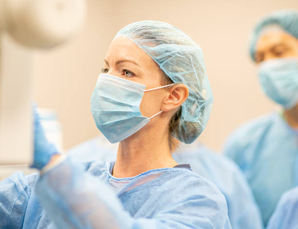 istock Group of surgeons examining a screen 1225965335