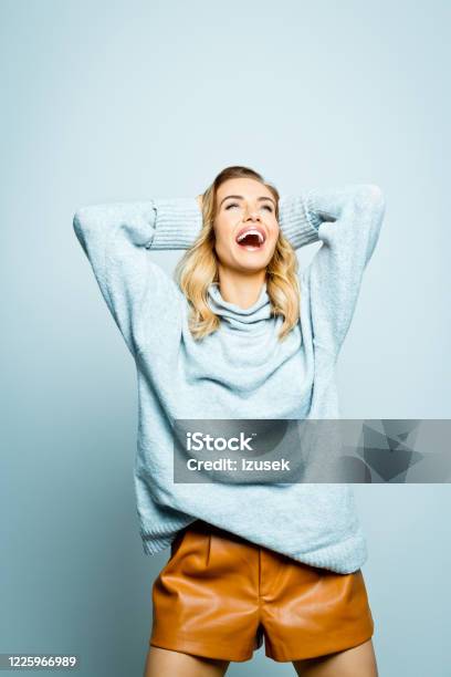 Autumn Portrait Of Excited Beautiful Woman Wearing Grey Sweater Stock Photo - Download Image Now