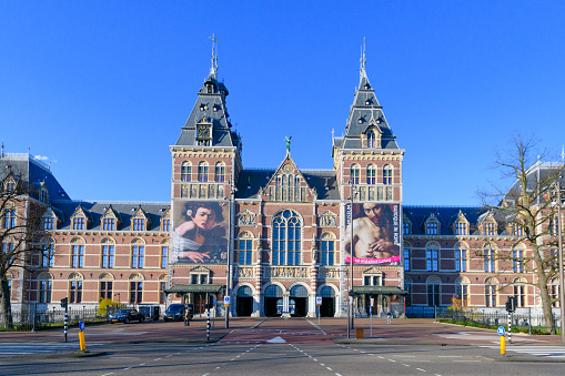 Rijksmuseum Amsterdam during a quiet springtime morning in the Capitol of The Netherlands. The Rijksmuseum is temporary closed due to the corona crisis.
