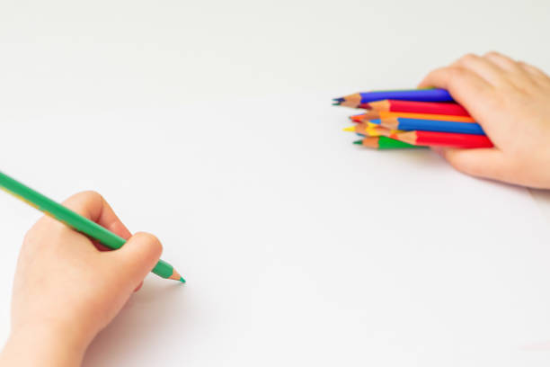 istock Child is drawing by colored pencils. 1225968192