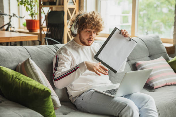 istock Manager or student working from home while being insulated or keep quarantine 'cause of coronavirus COVID-19. Conference online with colleague. 1225968663