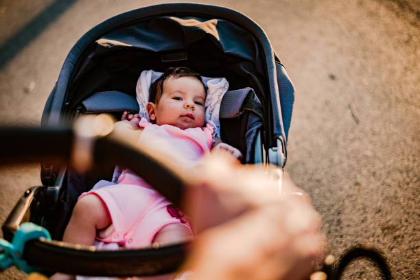 istock Father and newborn baby walking on sunset 1225969552
