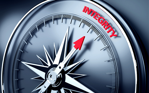Integrity text is in focus on three dimensional realistic compass's needle. High quality image is ready to crop all your social media sizes with copy space.