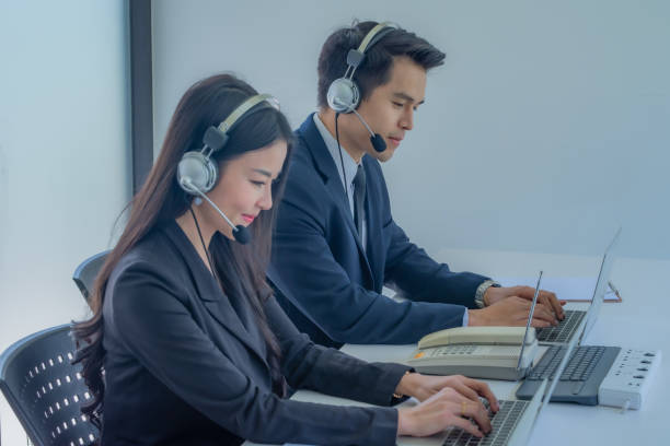 istock Young business team working with headset in office. 1225971538