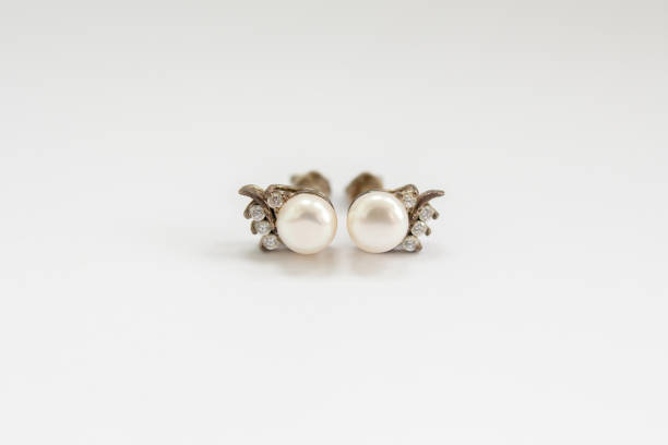 istock earrings with pearls on a white background 1225975966