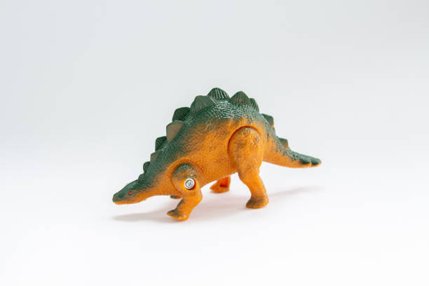 istock toy dinosaur on a white background 1225976915