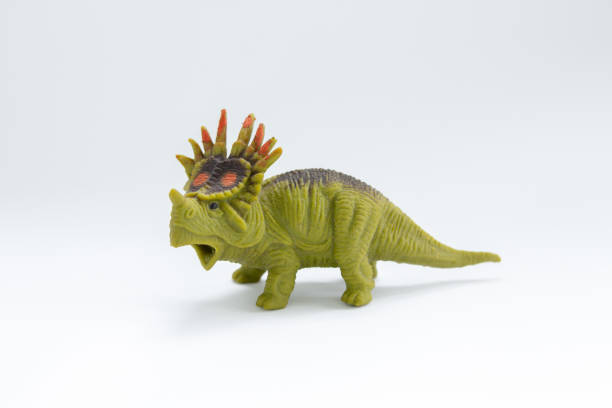 istock toy dinosaur on a white background 1225977387