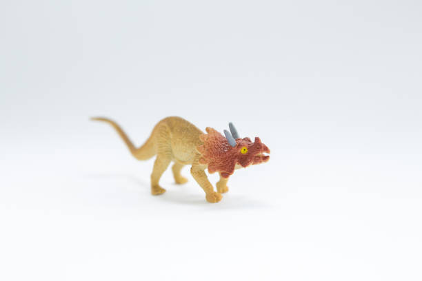 istock toy dinosaur on a white background 1225977432