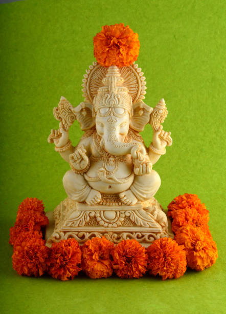 istock Hindu God Ganesha. Ganesha Idol on green background 1225977458